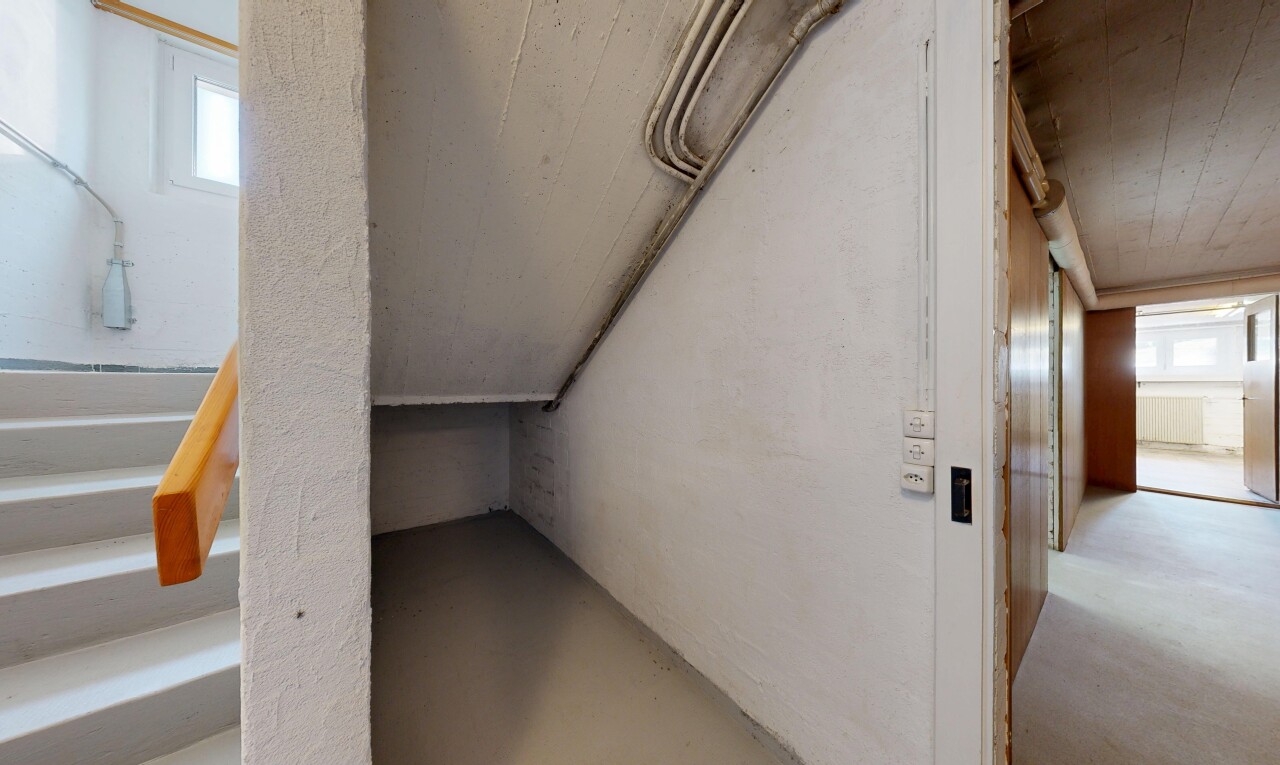 staircase with concrete floors