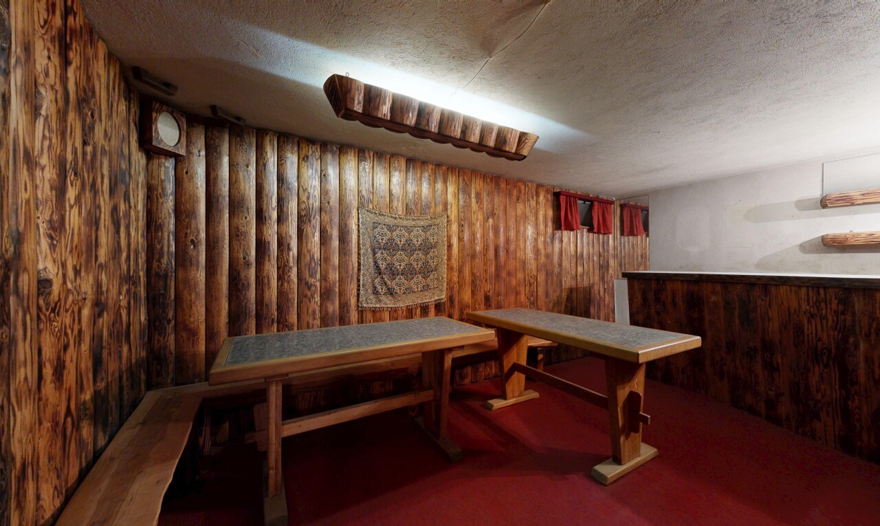 interior space with wood walls and a textured ceiling