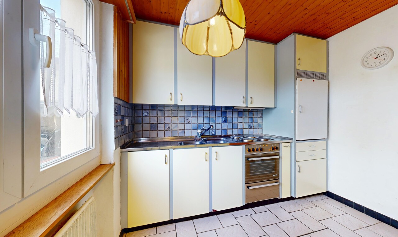 kitchen with wooden ceiling, backsplash, white cabinetry, and pendant lighting
