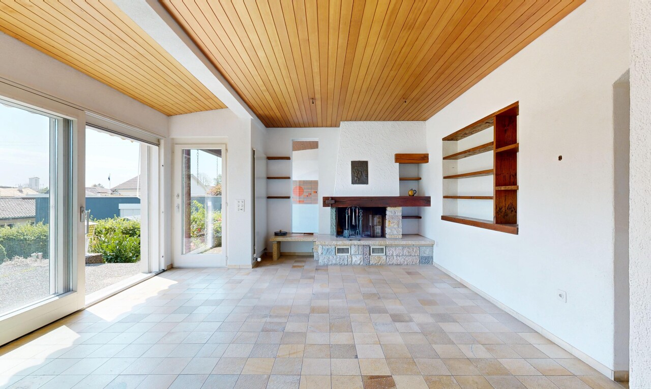 unfurnished living room featuring built in shelves and wood ceiling
