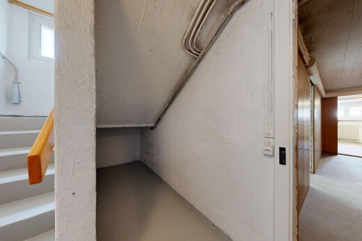staircase with concrete floors