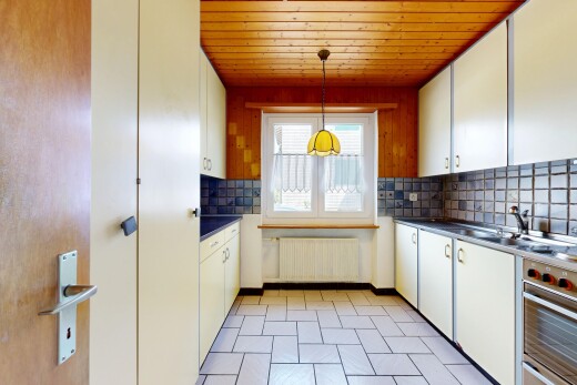kitchen featuring backsplash, white cabinetry, dark countertops, wood ceiling, and radiator
