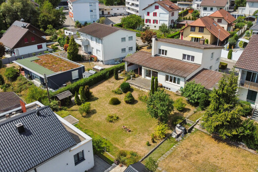 outdoor house featuring a residential view and a tiled roof