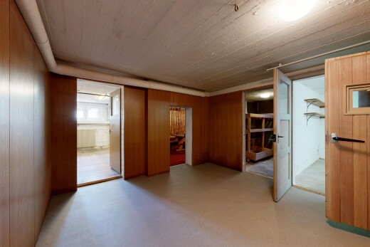 unfurnished room featuring wood walls