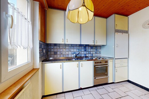 kitchen with wooden ceiling, backsplash, white cabinetry, and pendant lighting