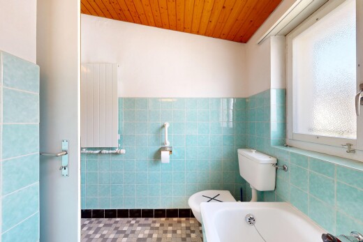 full bath with radiator heating unit, a bath, tile walls, wooden ceiling, and wainscoting