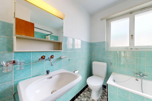 bathroom featuring a bath, tile walls, and tile patterned flooring