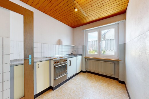 kitchen with wooden ceiling, radiator, decorative backsplash, a warming drawer, and light floors