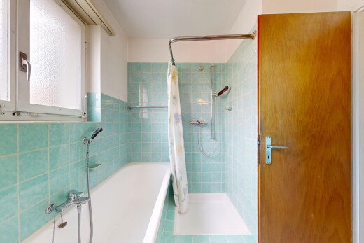 full bathroom with a stall shower, a bath, tile walls, and tile patterned floors