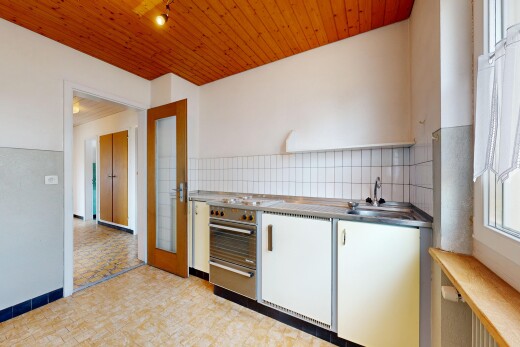 kitchen with wooden ceiling, decorative backsplash, white cabinetry, and light flooring