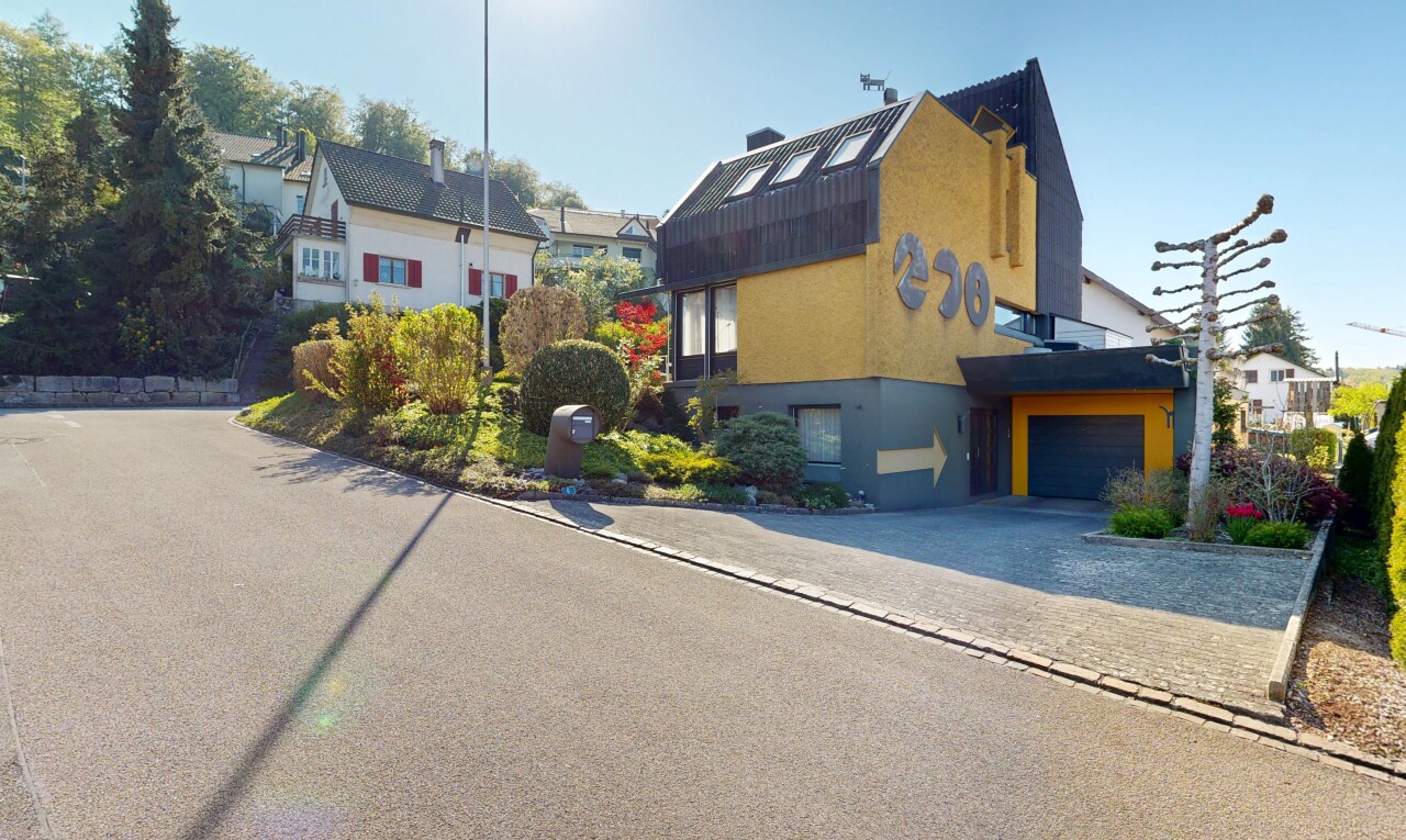 außenansicht mit stuckverkleidung, day time, auffahrt, und garage angeschlossen