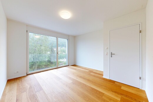 leerer raum mit inside property, natural light, natürliches licht, light floor, und drywall