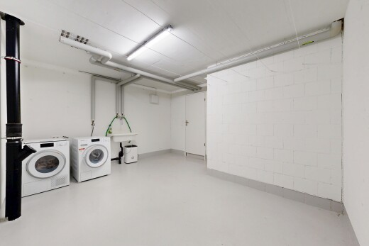 laundry area with finished concrete flooring and washer and dryer