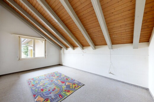 empty room featuring carpet flooring and wood ceiling