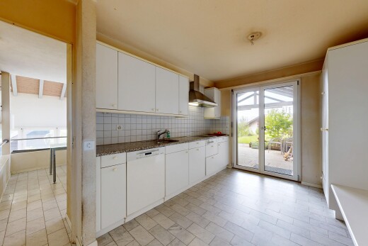 kitchen with backsplash, wall chimney range hood, white dishwasher, white cabinetry, and dark stone countertops