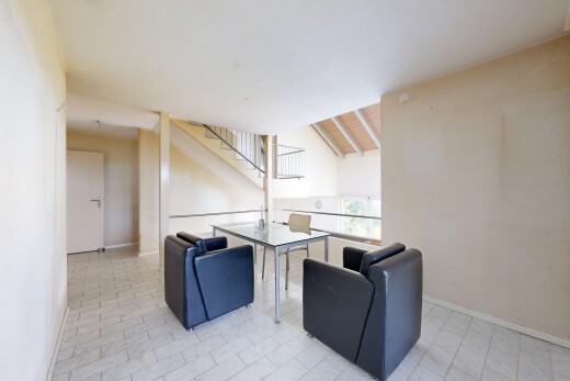 living room with stairs and baseboards