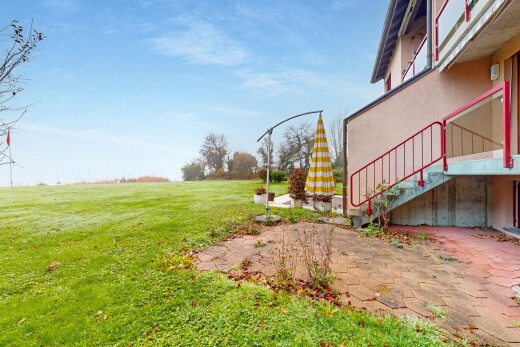garden with stairs, a yard, and a patio area