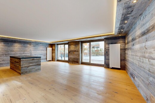 pièce vide avec mur en bois, wood wall, sol en finition bois, wood finish floor, et radiateur