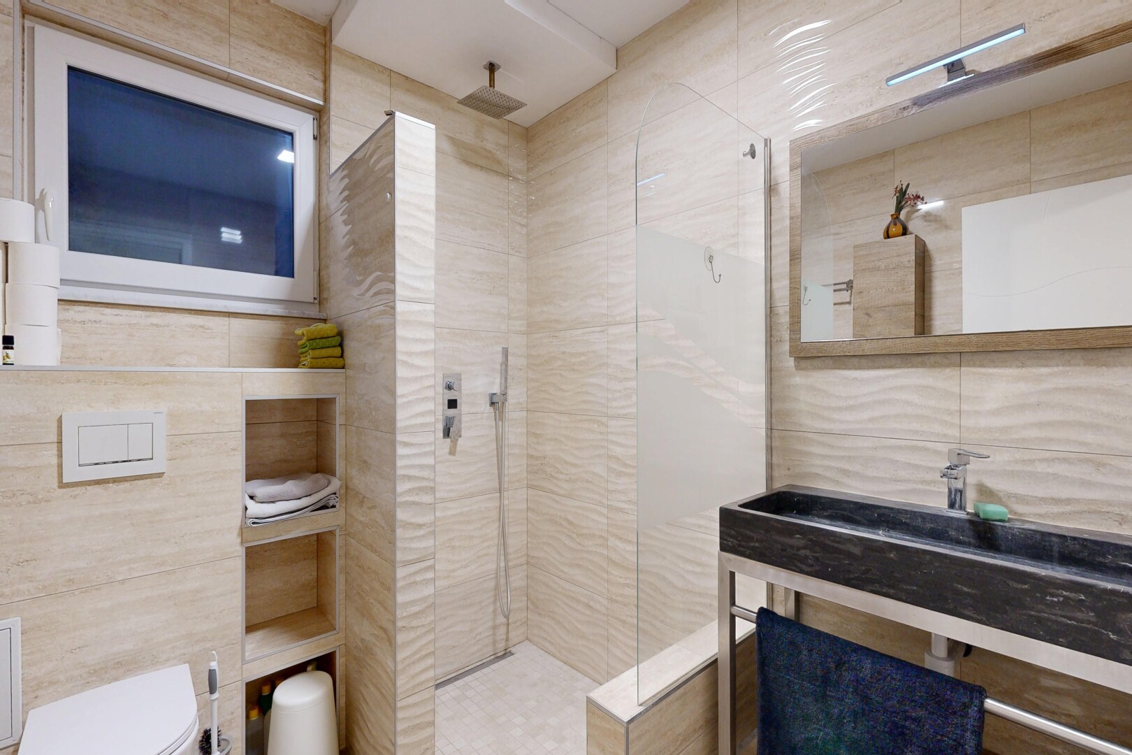 full bathroom featuring tile walls and a walk in shower