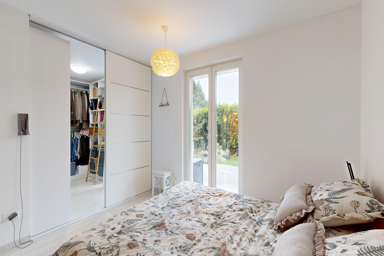 room featuring access to exterior and a closet
