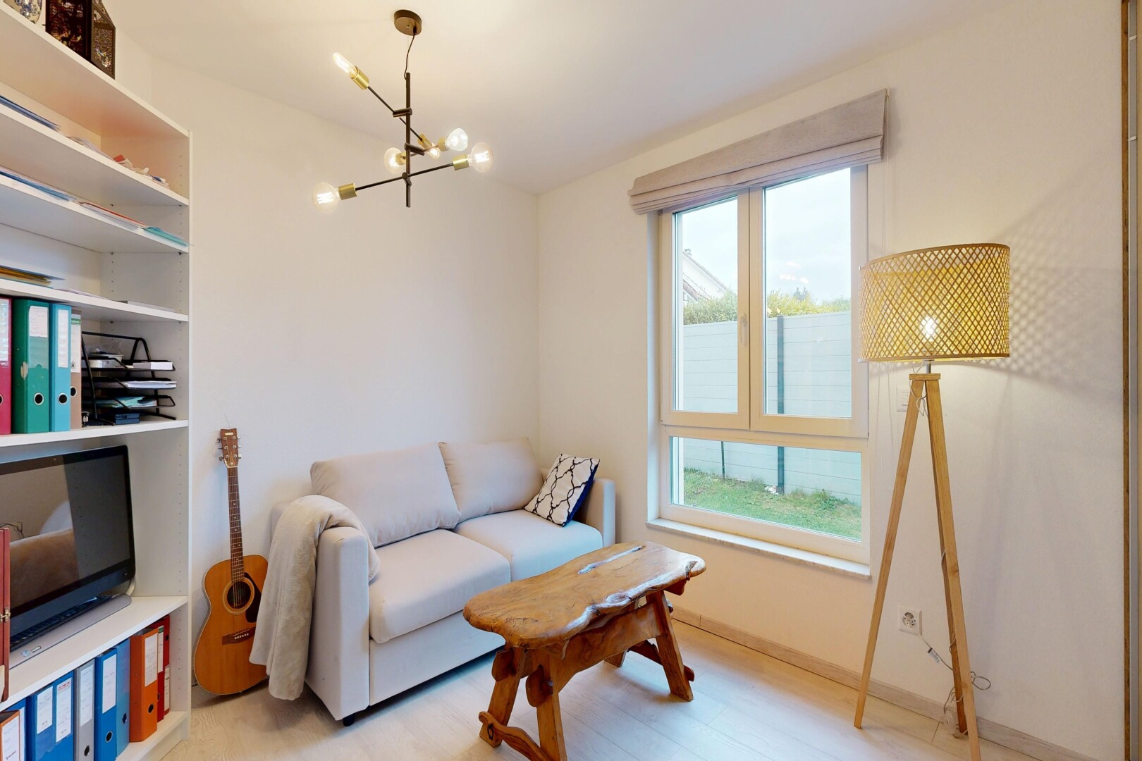 living room featuring a chandelier and light wood-type flooring