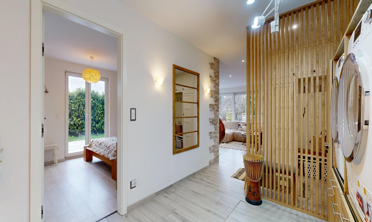 corridor with plenty of natural light, light wood-style floors, and recessed lighting