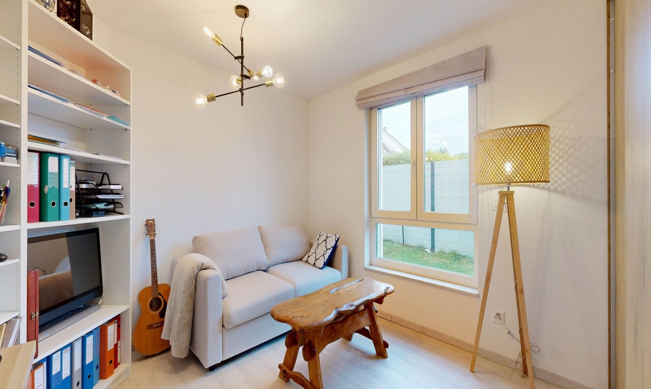 living room featuring a chandelier and light wood-type flooring
