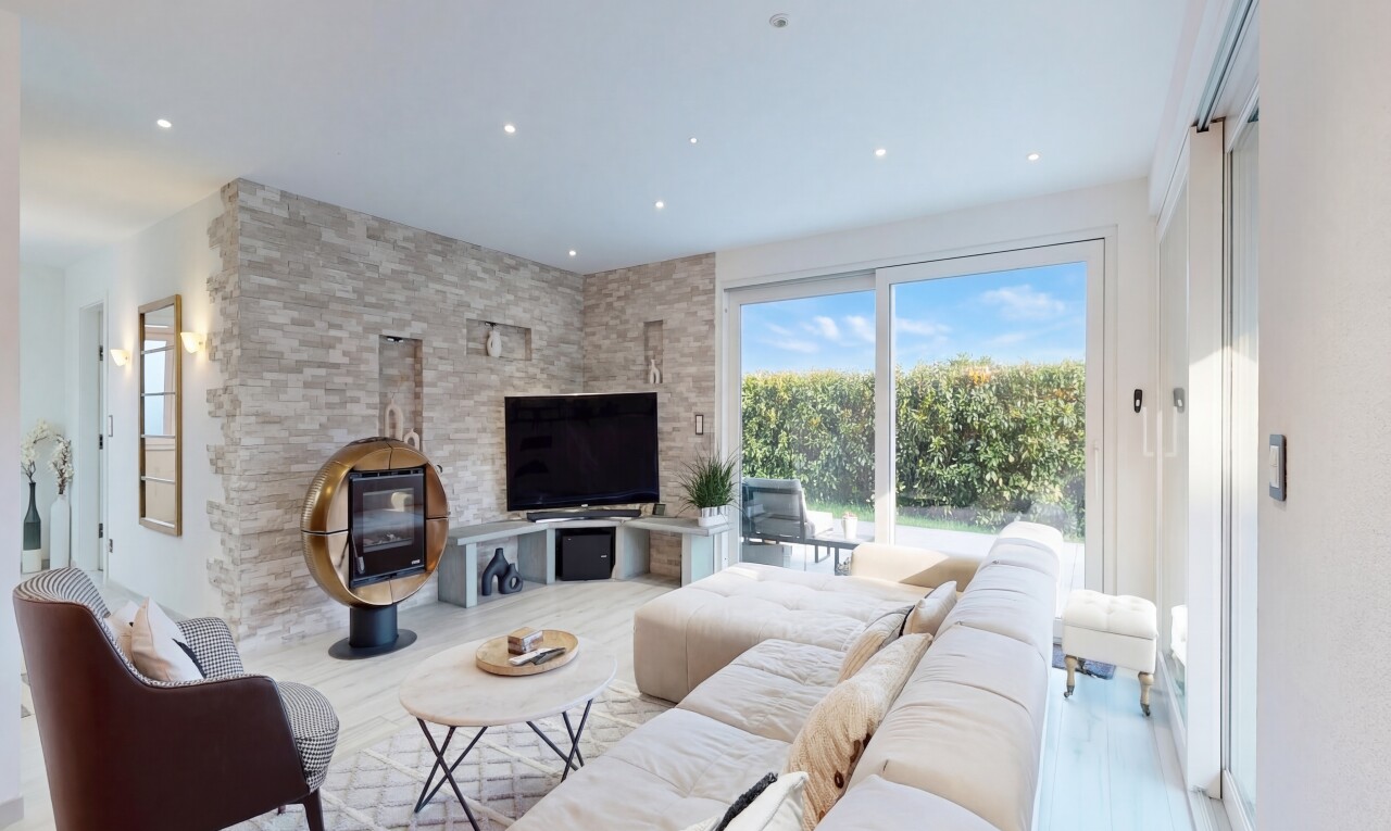 living room featuring a wood stove, wood finished floors, and recessed lighting