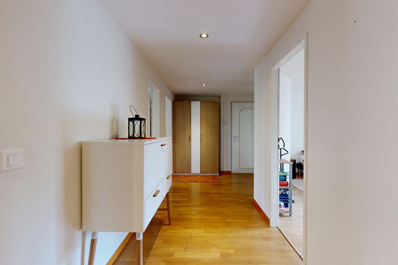 hall with light wood-type flooring and recessed lighting