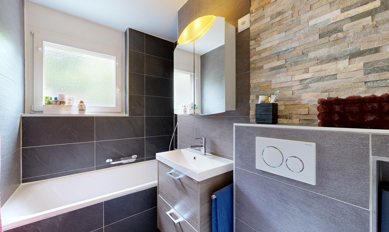 full bathroom with a bath, vanity, tile walls, and a shower