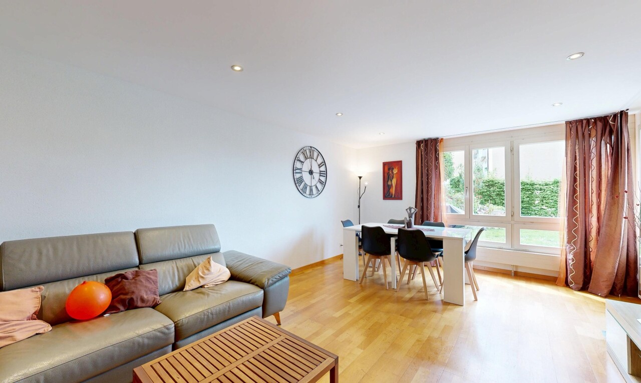 living room with light wood finished floors and recessed lighting