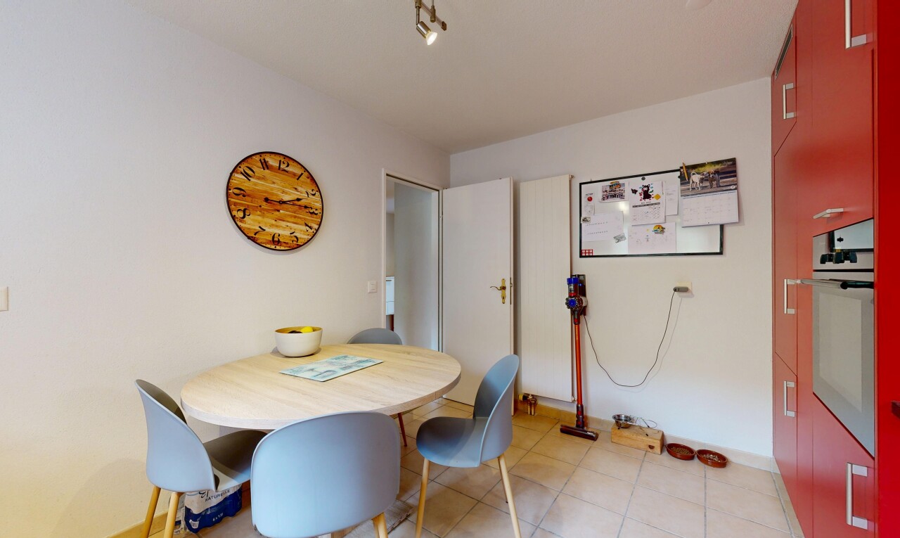 dining area with baseboards and light tile patterned flooring