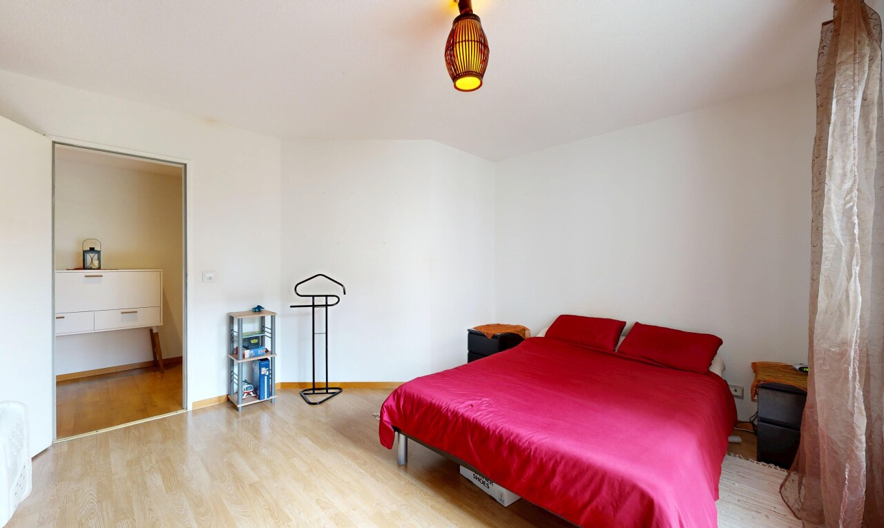 room / bedroom with wood finished floors