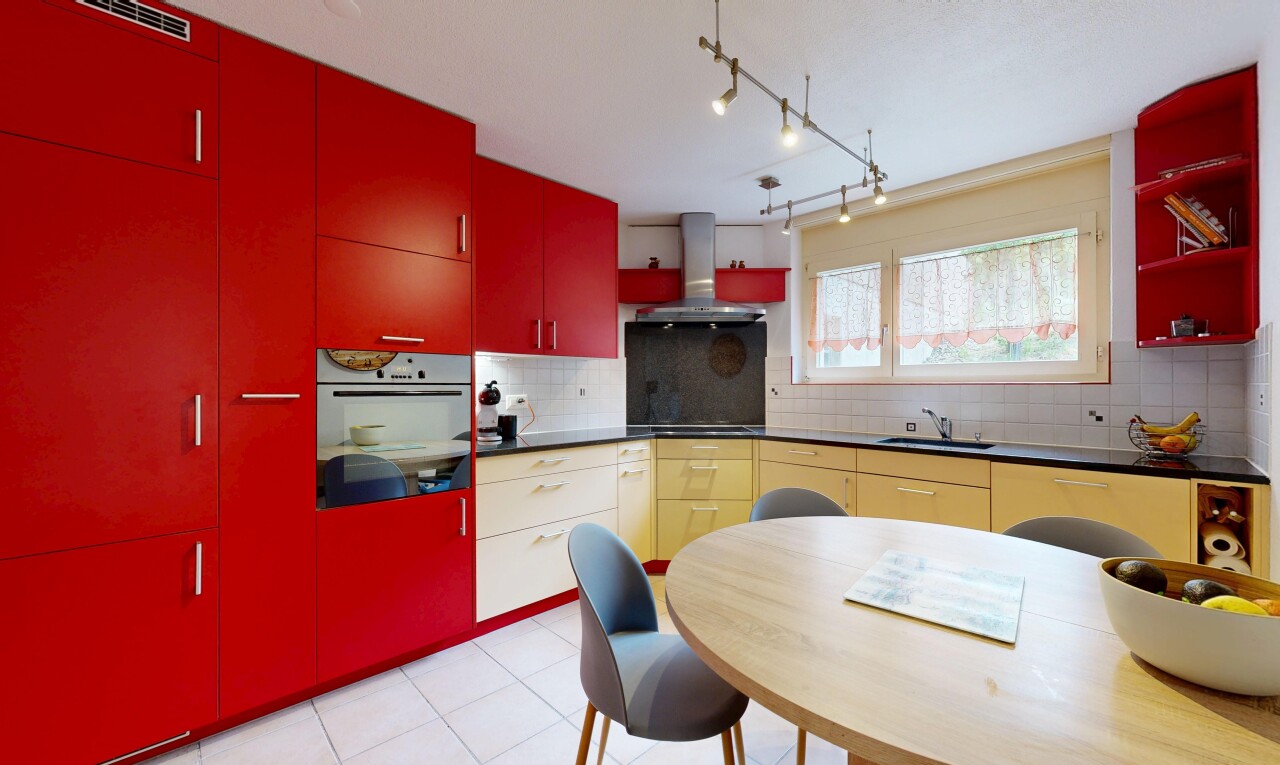 kitchen with red cabinets, dark countertops, oven, ventilation hood, and open shelves