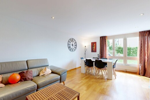 living room with light wood finished floors and recessed lighting