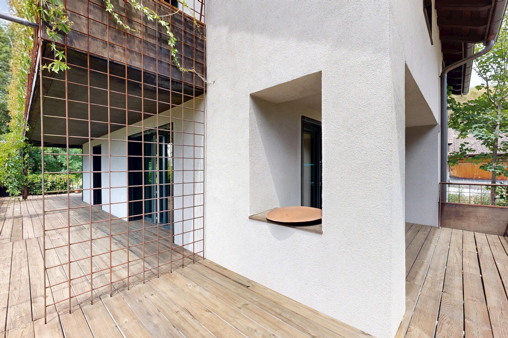 view of wooden terrace with a balcony