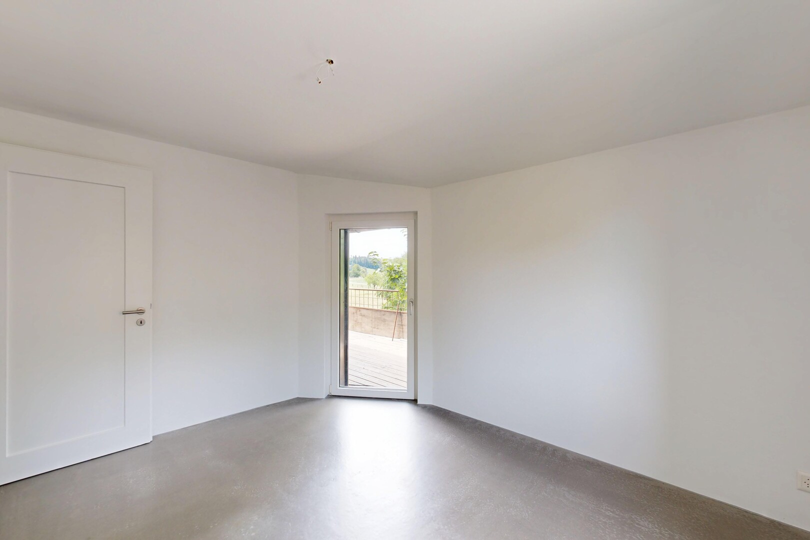 spare room with concrete flooring