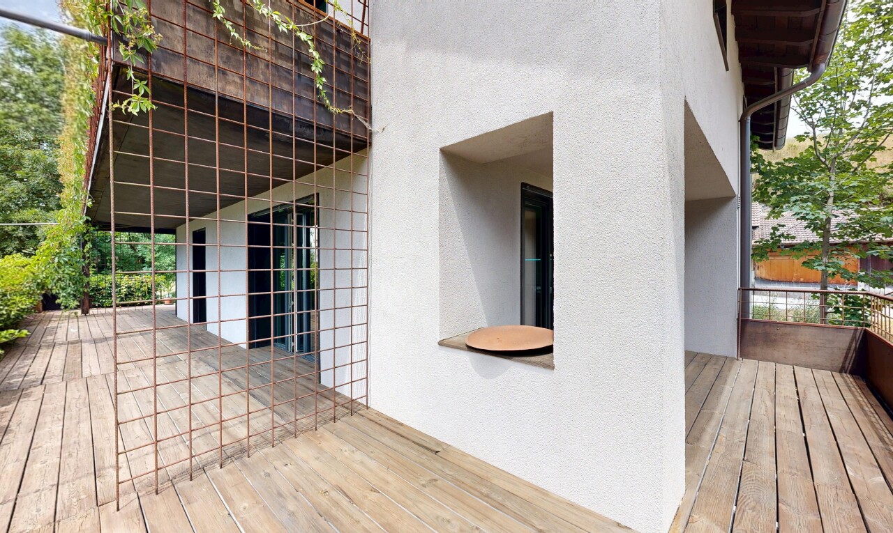 view of wooden terrace with a balcony