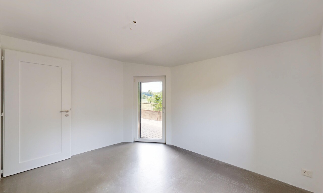 spare room with concrete flooring