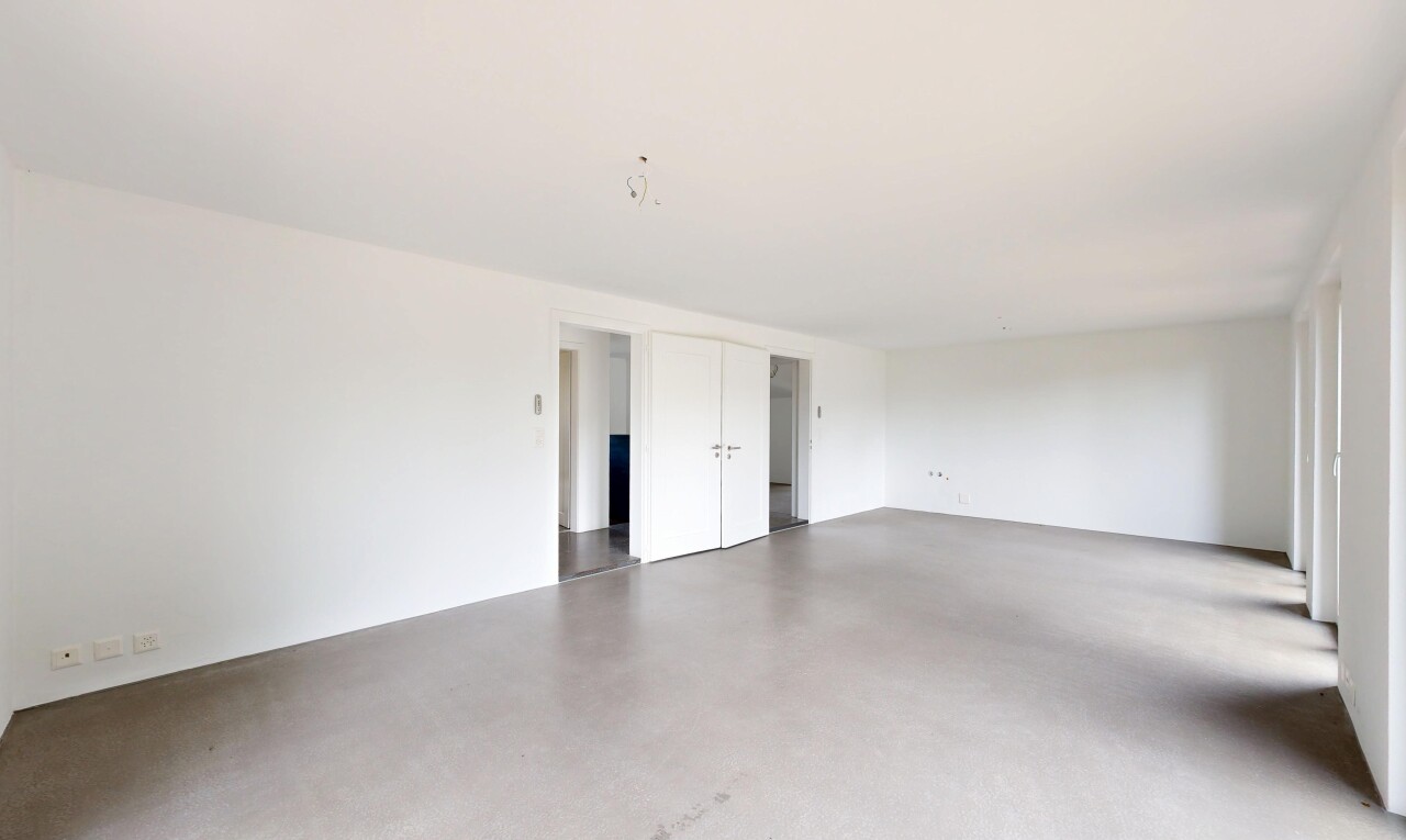 unfurnished room with concrete flooring