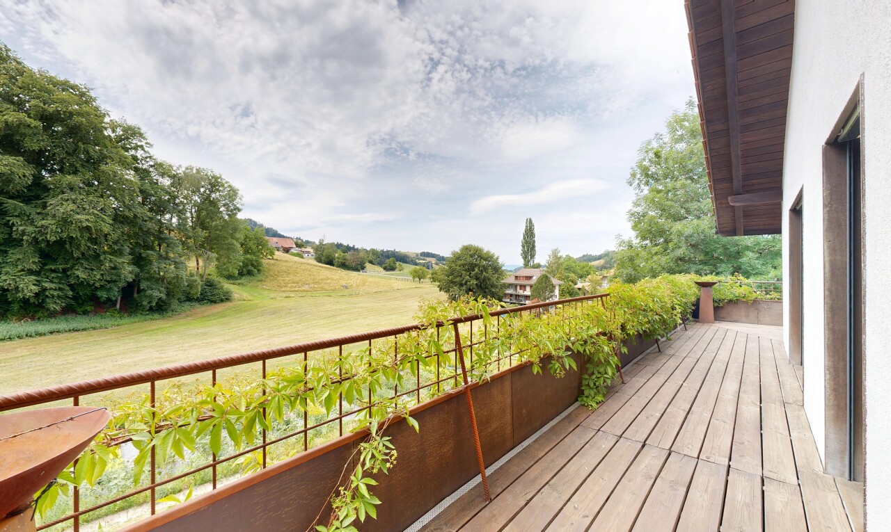 view of wooden balcony featuring a wooden deck