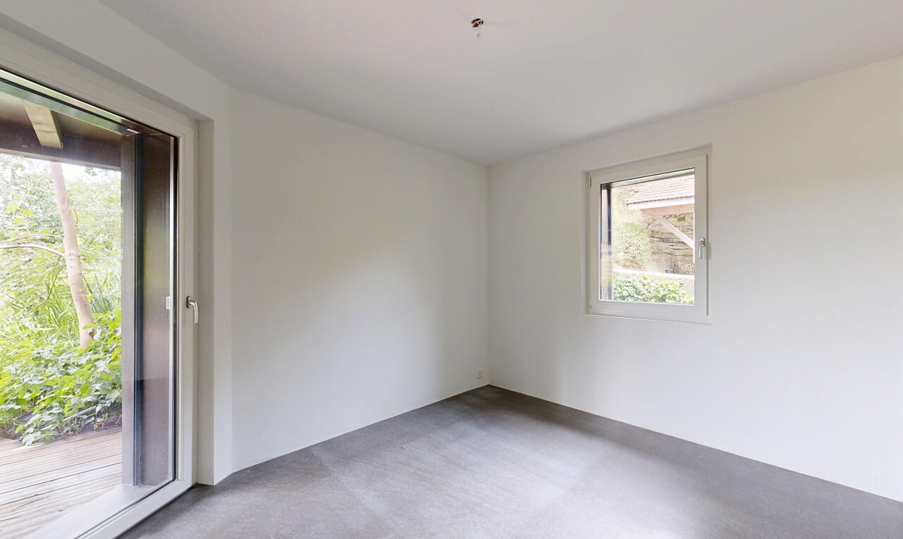 empty room featuring light colored carpet