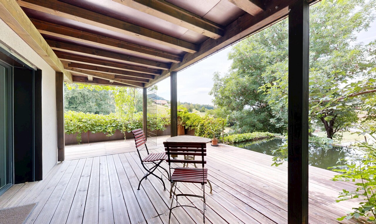 terrace with a deck with water view