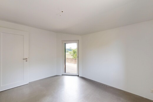 spare room with concrete flooring