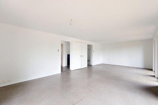 unfurnished room with concrete flooring