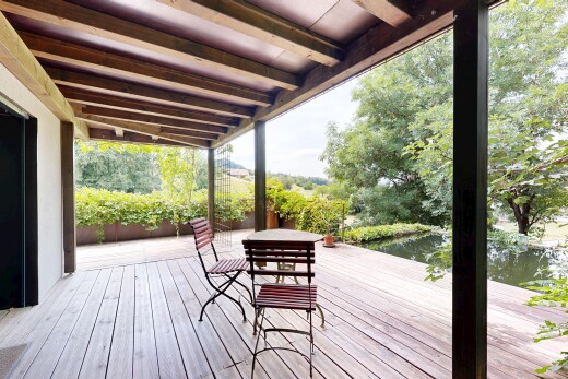 terrace with a deck with water view