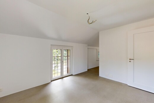 empty room with vaulted ceiling