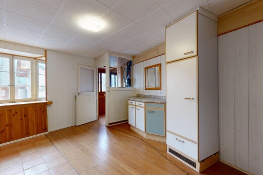 kitchen featuring light countertops, plenty of natural light, light wood-style floors, and a paneled ceiling