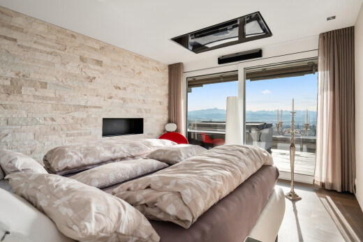 chambre avec inside property, mur en pierre, stone wall, accès à l'extérieur, et lumière naturelle