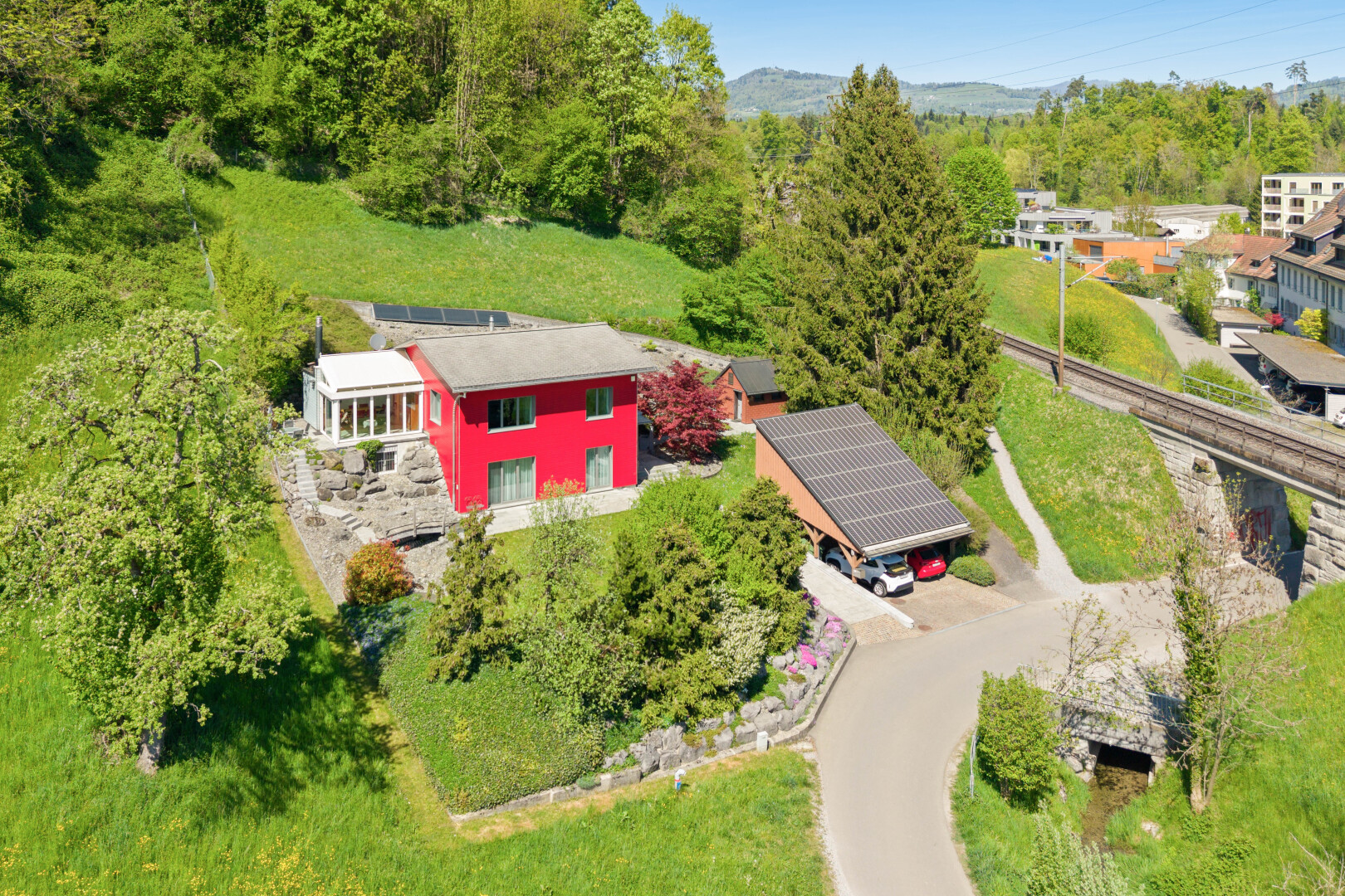 outdoor house with ground mounted solar panels